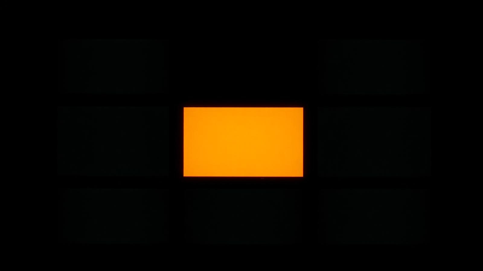 A grid of dark monitor panels with one glowing ember panel